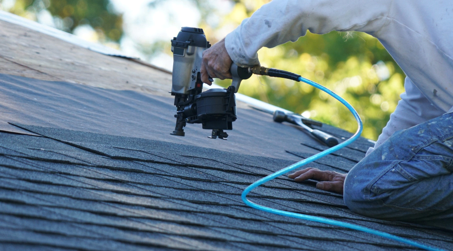 close up of a roofer repairing a shingle roof shreveport la 1